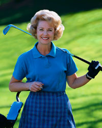 Picture of an elderly lady with her golf clubs
