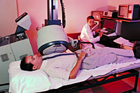 A picture of patient and technologist during a scan