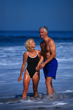 Picture of elderly couple walking on the beach