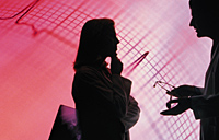 Picture of an ECG strip with a silhouette of a male and female over it