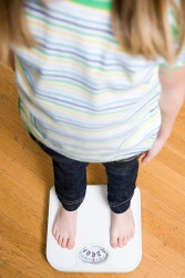 Girl standing on a scale
