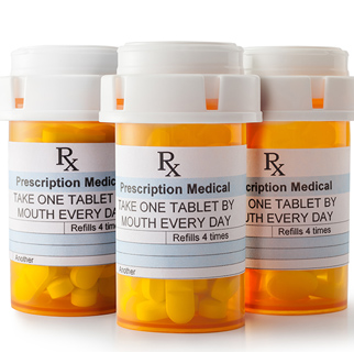 Close up image of three prescription medicine bottles.