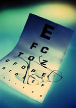 Picture of an eye chart and pair of eyeglasses